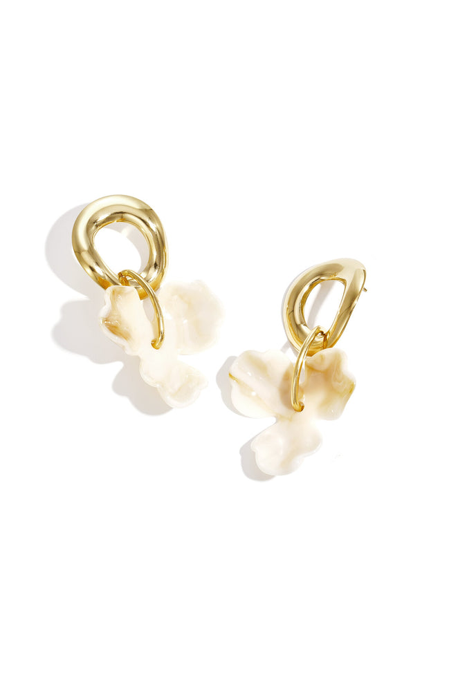Round earrings with hanging flower