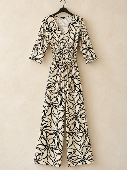 Smashed Lemon crème-zwarte jumpsuit met bloemenprint maat 38