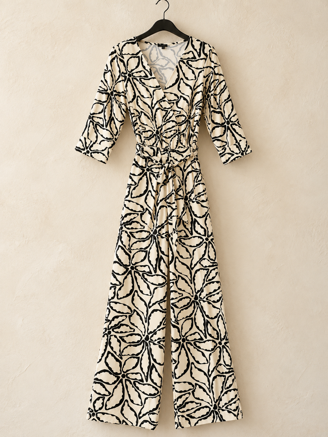 Smashed Lemon crème-zwarte jumpsuit met bloemenprint maat 38